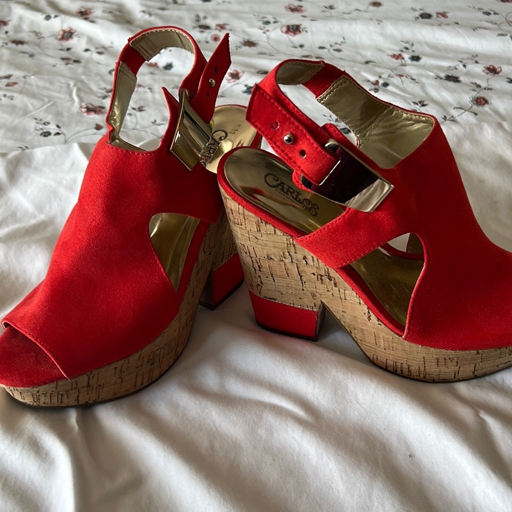Red high heels by Carlos Santana